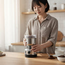 Topteck electric coffee grinder with stainless steel blades, grinding coffee beans for fresh brew. Compact and easy to use.
